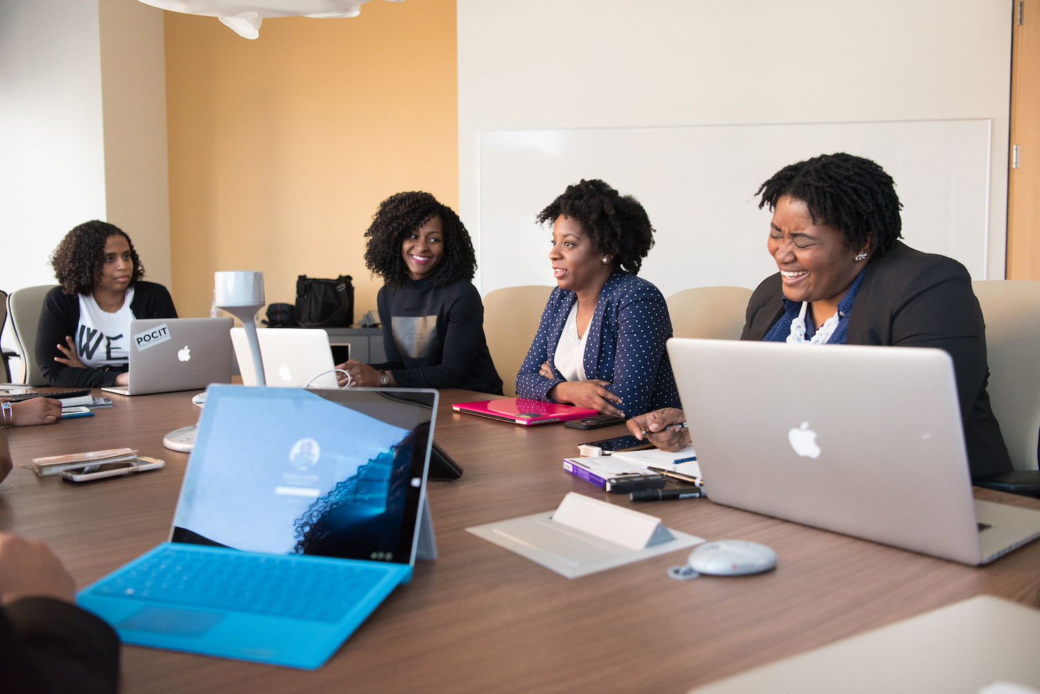 Group of Women Talking at a Conference Table